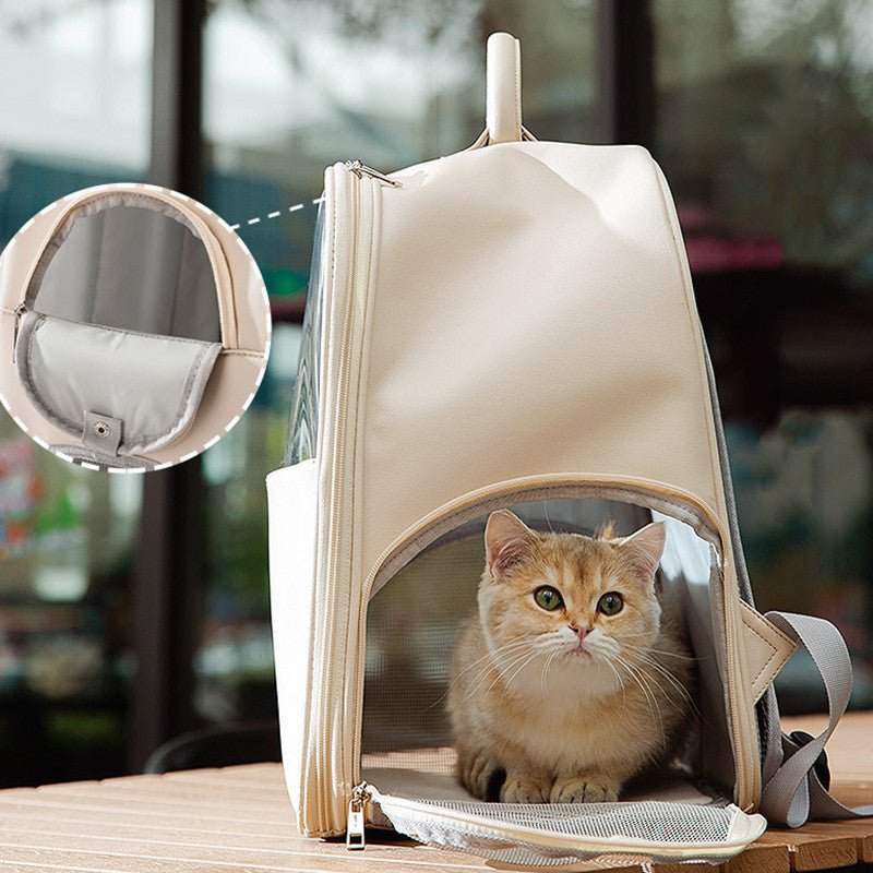 Cream cat backpack carrier with transparent front panel and zipper opening, cat inside