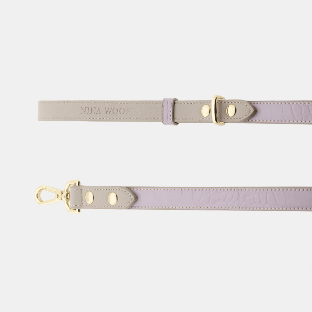 Lilac vegan leather dog leash with gold clip, adjustable holes, and matching strap