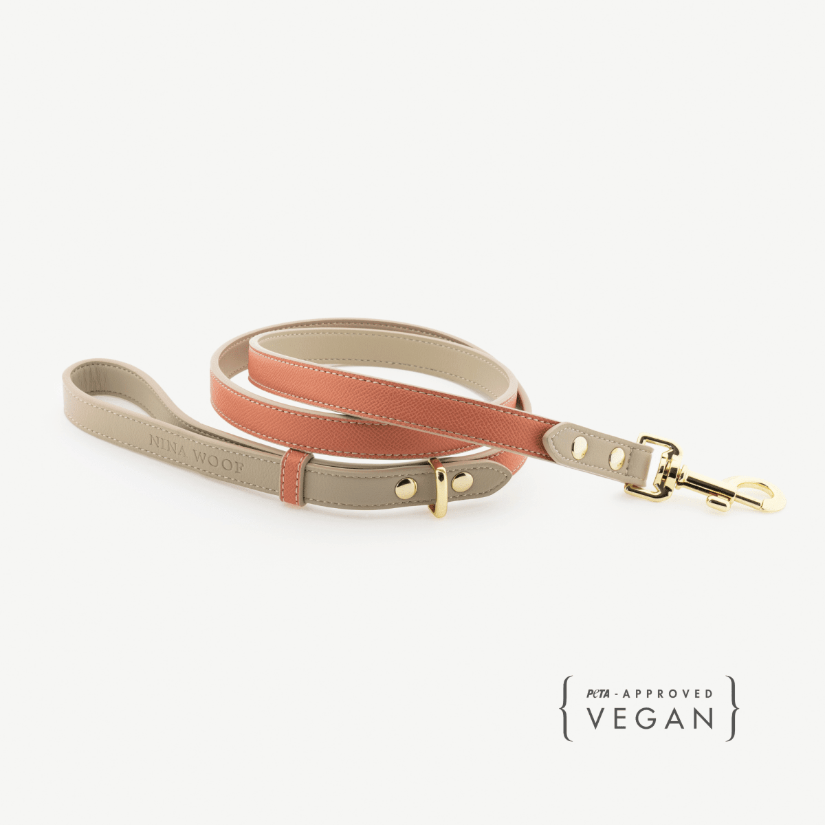 Beige and orange vegan leather dog leash with gold clasp and D-ring