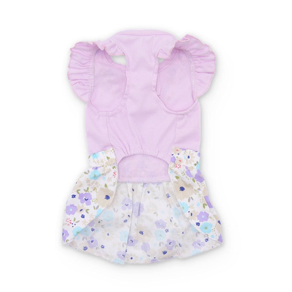 Lavender cross-back dress with puffed sleeves and pastel floral gathered skirt, back view