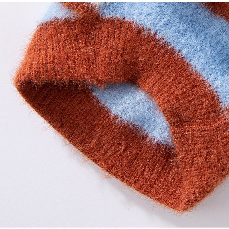 Dog sweater arm opening detail with brown trim on blue knit stripe design