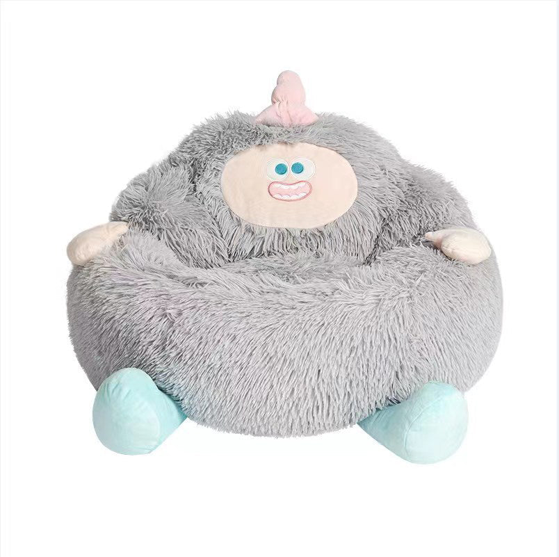 Gray plush pet nest bed with smiling face patch, rounded bolster, and light blue feet pads