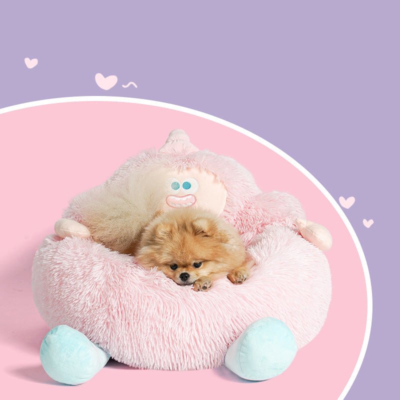 Pink plush pet nest bed with round bolster, cute face patch, and light blue feet pads