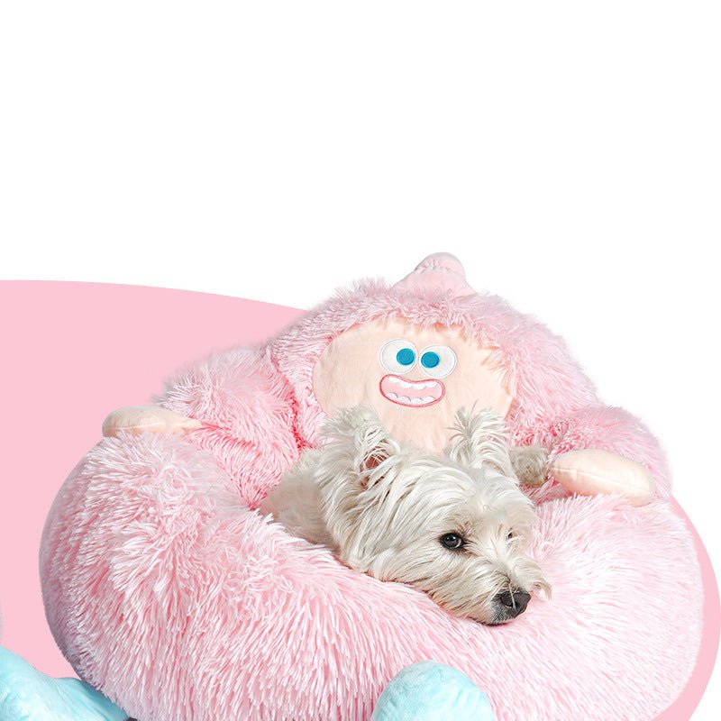 Pink plush pet nest bed with smiling face applique and rounded sleeping ring