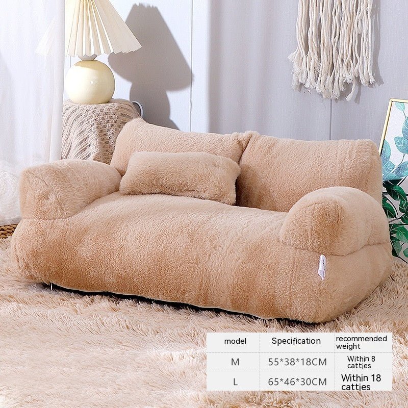 Beige plush pet bed sofa with pillow back and curved arm cushions