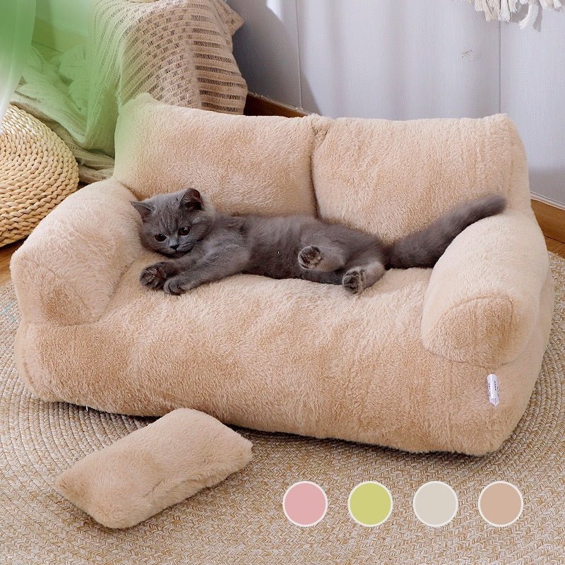 Beige plush cat bed sofa with raised bolsters and cushioned center