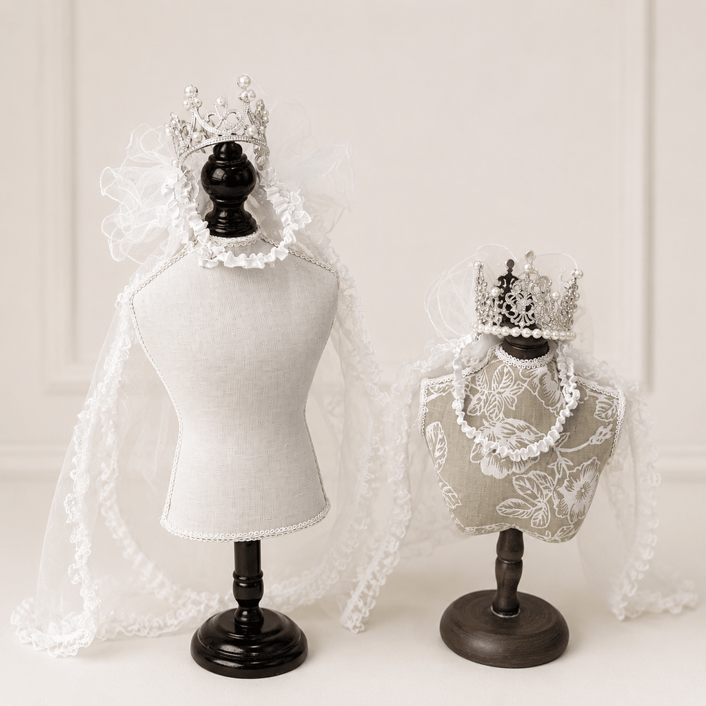 White lace pet bridal veil with pearl crown tiara, draped over a padded headpiece
