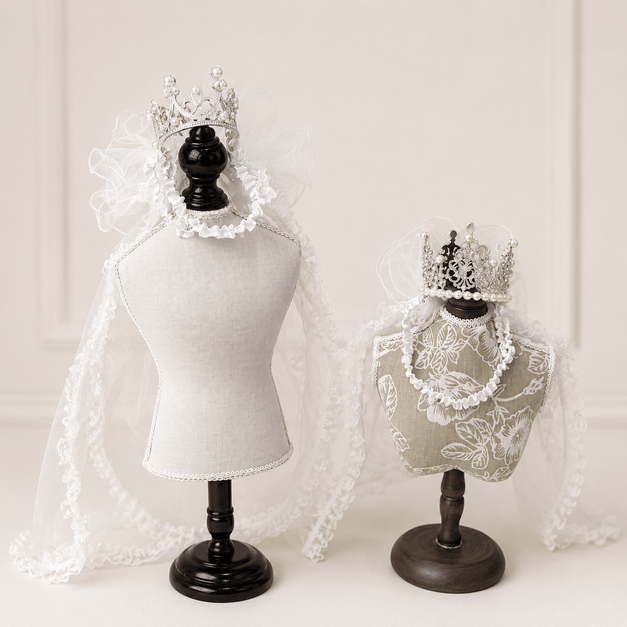 White lace pet bridal veil with pearl crown tiara, draped over a padded headpiece