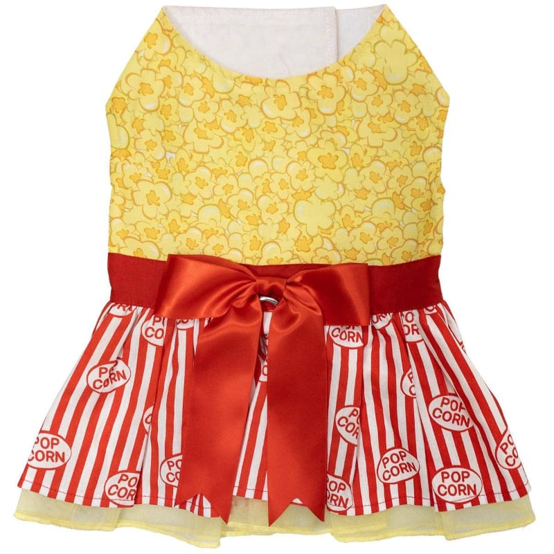 Yellow popcorn-pattern dog dress with red sash bow and red-and-white striped skirt