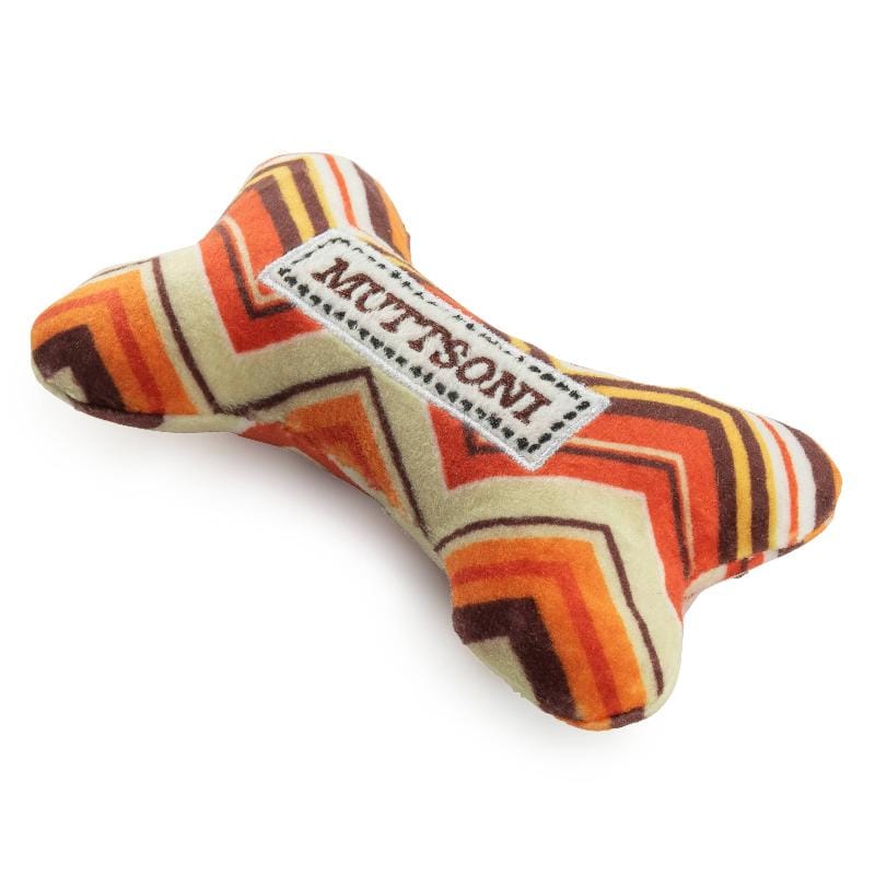 Muttsoni plush bone squeaker toy, side view, zigzag chevron pattern and tag