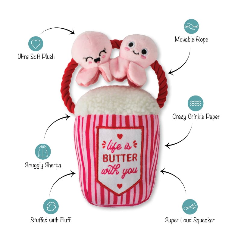 Pink plush squeaky dog toy butter-cup design with rope handle and two bunny plush ears