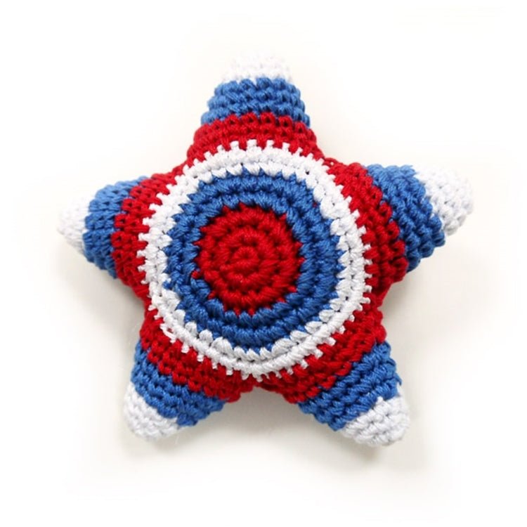 Crocheted star toy front view with blue ring and red center, striped in red and white
