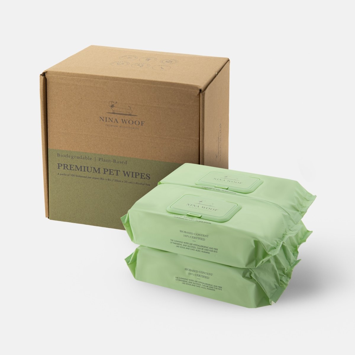 Brown shipping box and green Nina Woof premium pet wipes packs