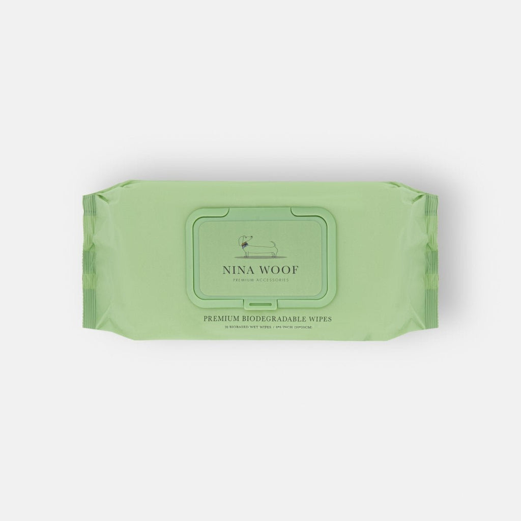 Front view of green Nina Woof biodegradable pet grooming wipes pack