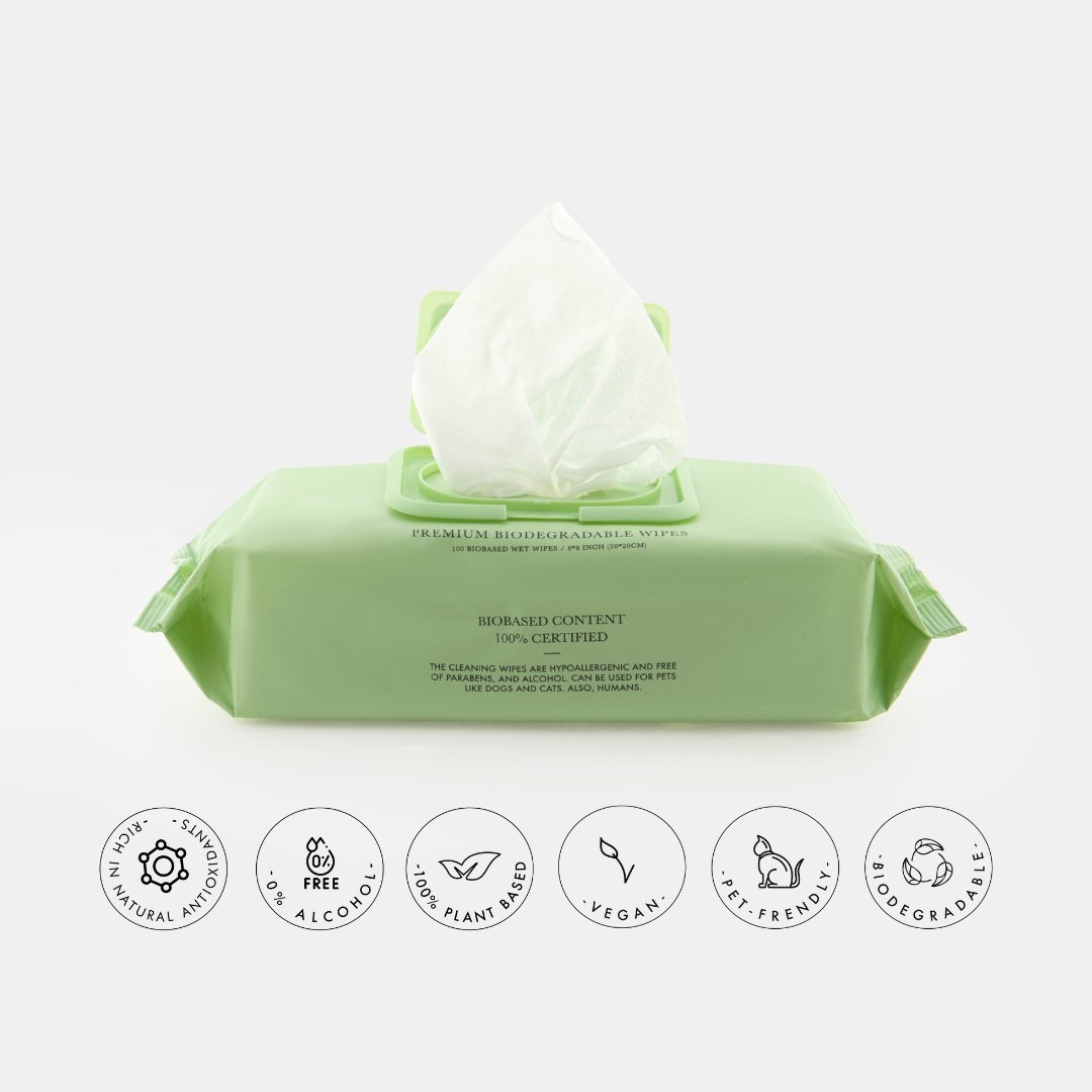 Green biodegradable pet grooming wipes pack back with feature icons and seals