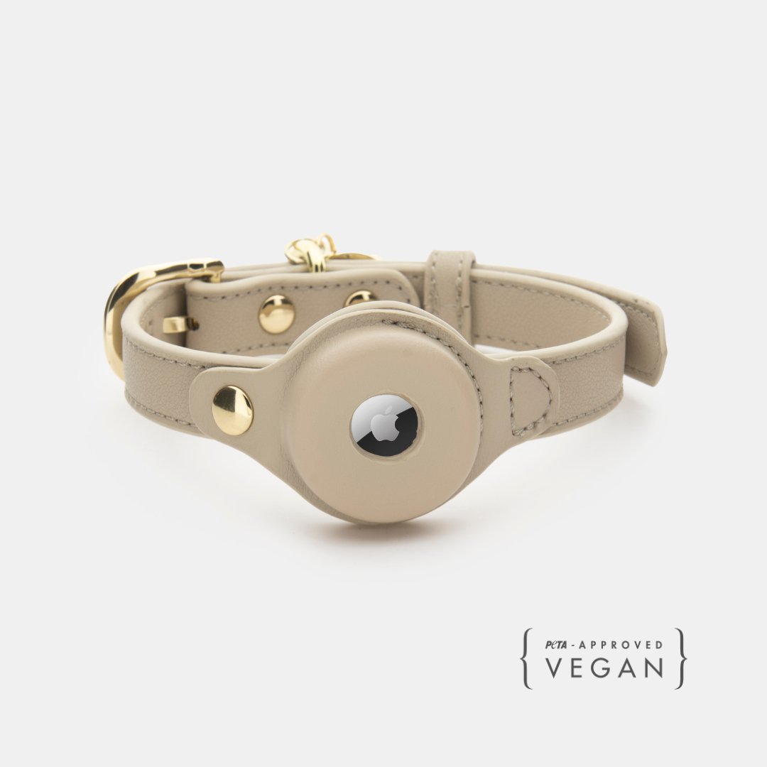 Beige vegan leather dog collar with AirTag holder and gold-tone hardware
