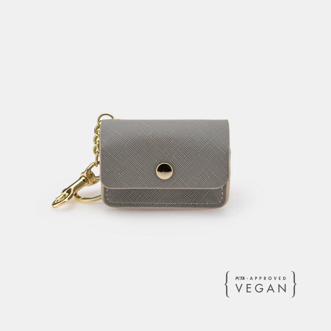 Grey vegan leather dog waste pouch with snap flap and gold chain clip
