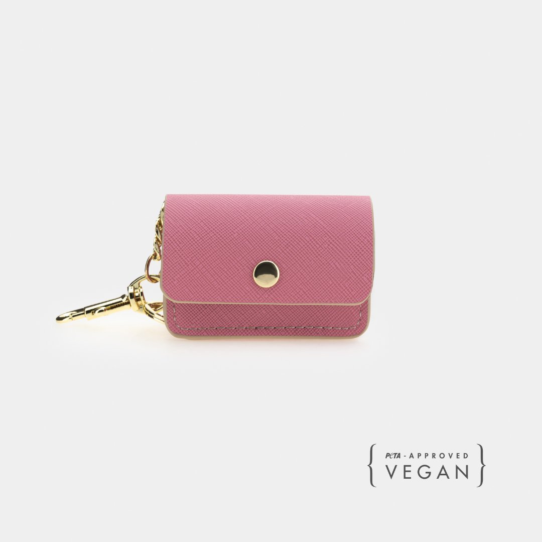 Pink vegan leather dog waste pouch with snap flap and gold key-ring clip