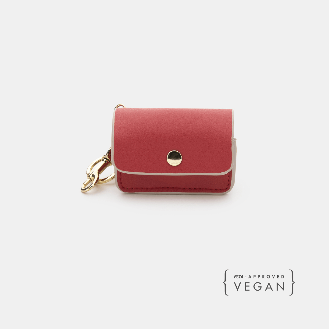 Red vegan leather dog waste pouch with snap flap and gold key-ring clip