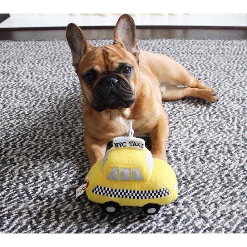 Yellow plush taxi dog toy with checkered bumper and tabdogs logo