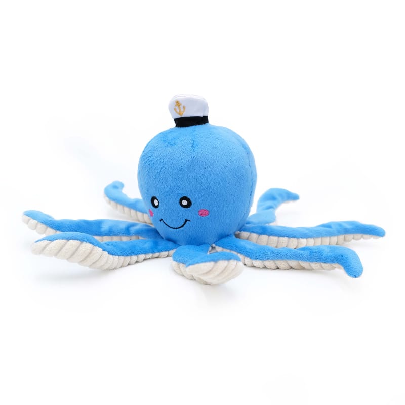 Blue plush octopus dog toy lying down, sailor hat with anchor, tentacles spread