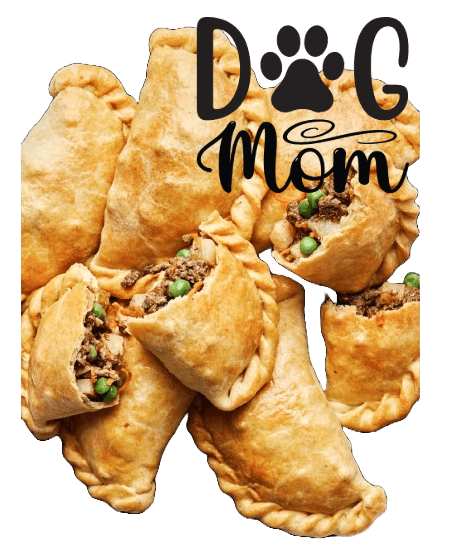 Golden-brown dog empanadas with crimped edges and visible beef filling