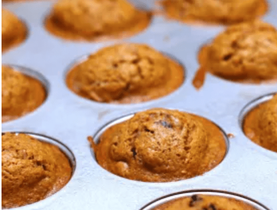 Assorted dog sweet potato muffins in cups, golden-brown