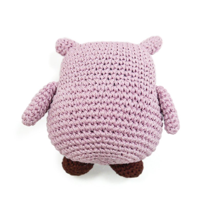 Crochet owl toy in mauve with textured body, small ear flaps, and brown feet