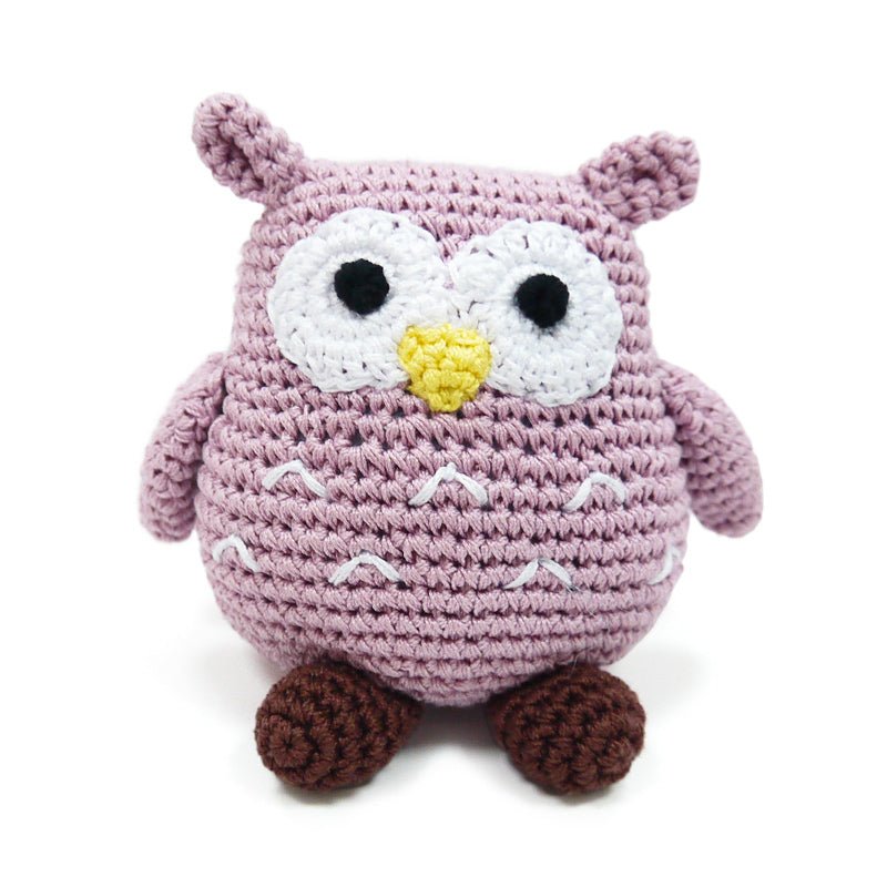 Crochet owl toy in mauve with white face, yellow beak, black eyes, and brown feet