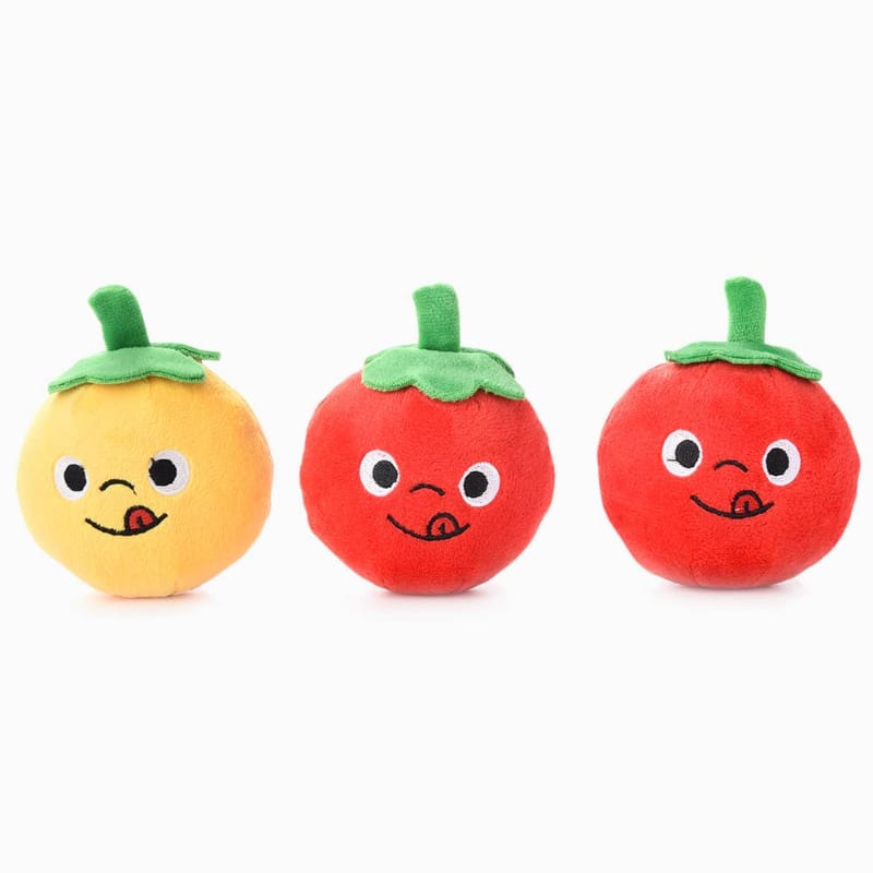 Set of three plush tomato dog toys, yellow and two red round faces with green stems