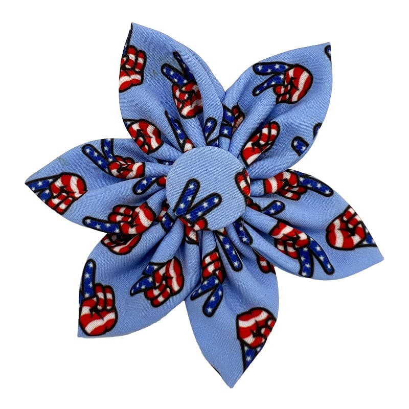 Blue pinwheel dog collar bow with patriotic paw and candy-cane pattern