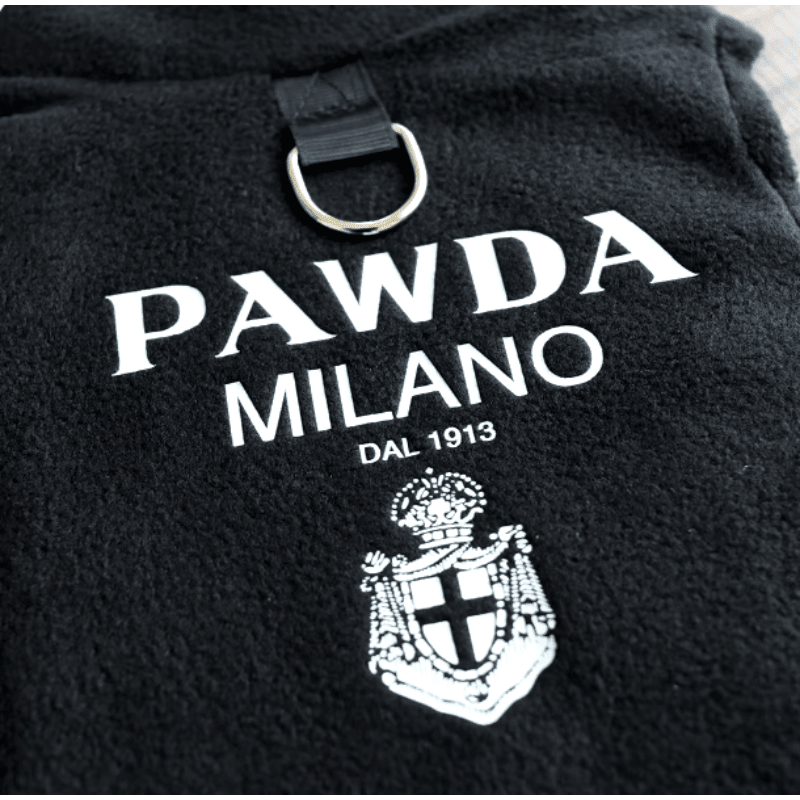 Black fleece pet pullover close-up of PAWDA MILANO logo, crest, and front strap
