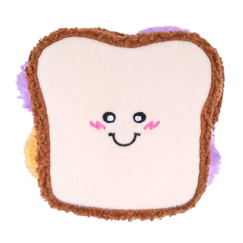 Plush sandwich dog toy, white bread with brown crust and smiling face, snuffle stuffing