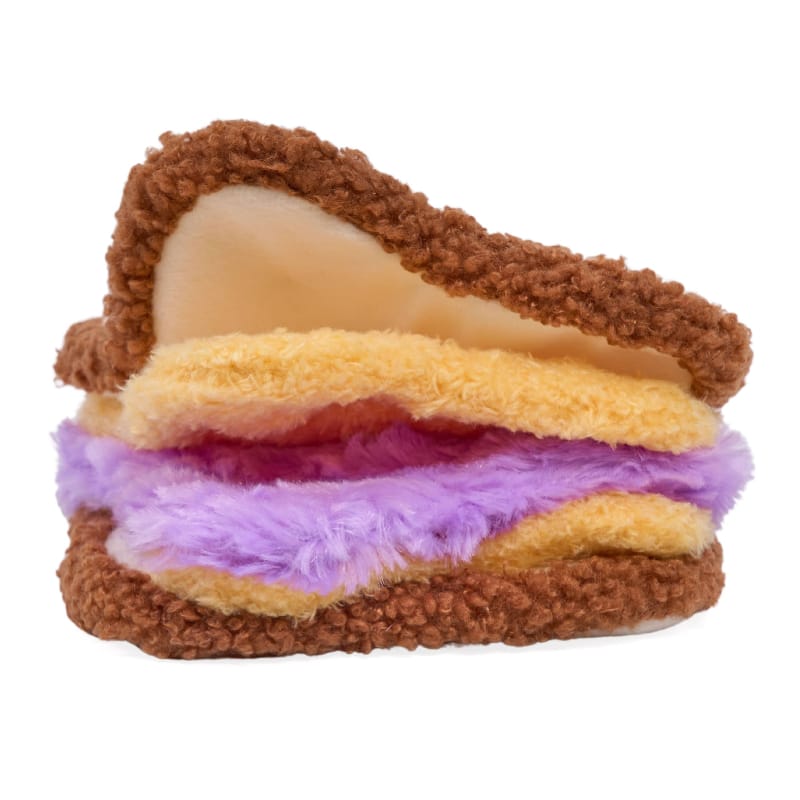 Plush sandwich dog toy with brown bread, yellow cheese layer, and purple filling