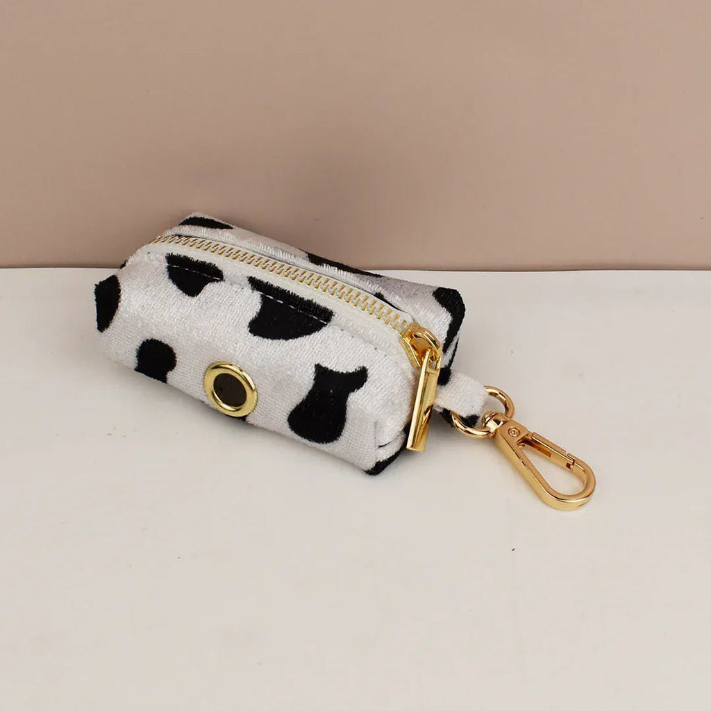 Cow print zip pouch with gold ring and carabiner clip