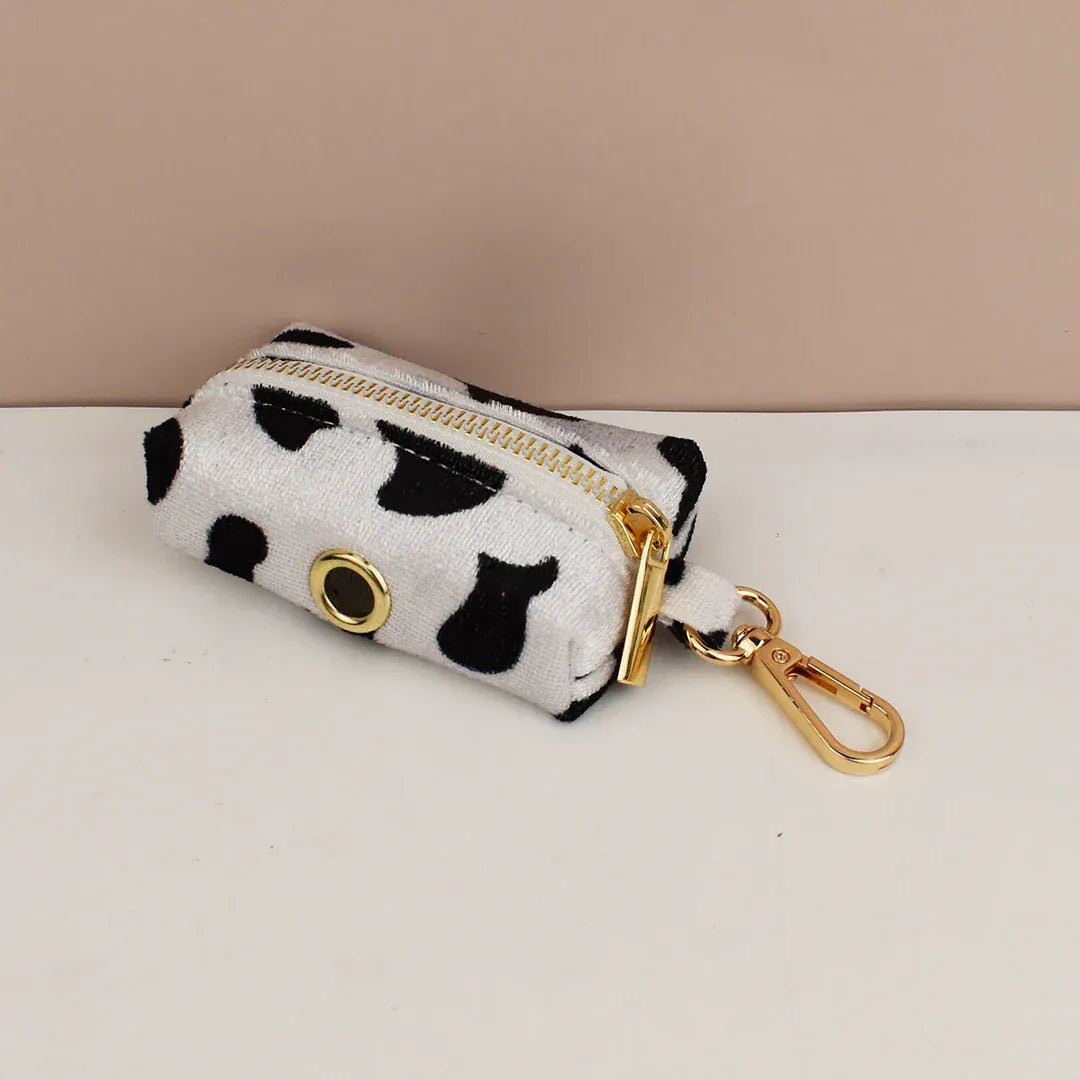 Cow print zip pouch with gold ring and carabiner clip