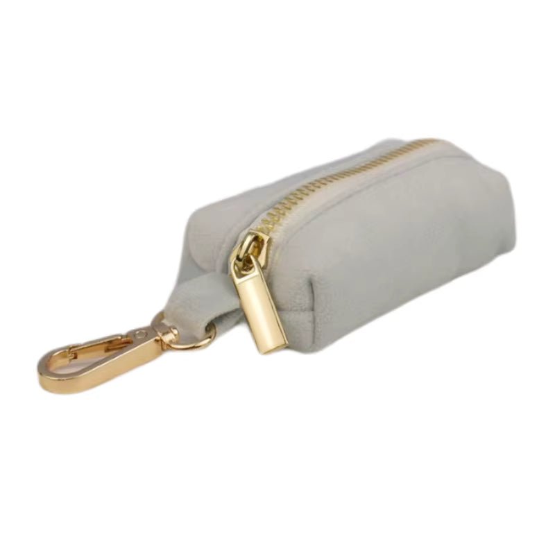 Light blue velvet pouch with gold zipper and keyring clip detail