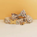 Ivory floral dog collar set with matching bowtie and leash, gold-tone hardware