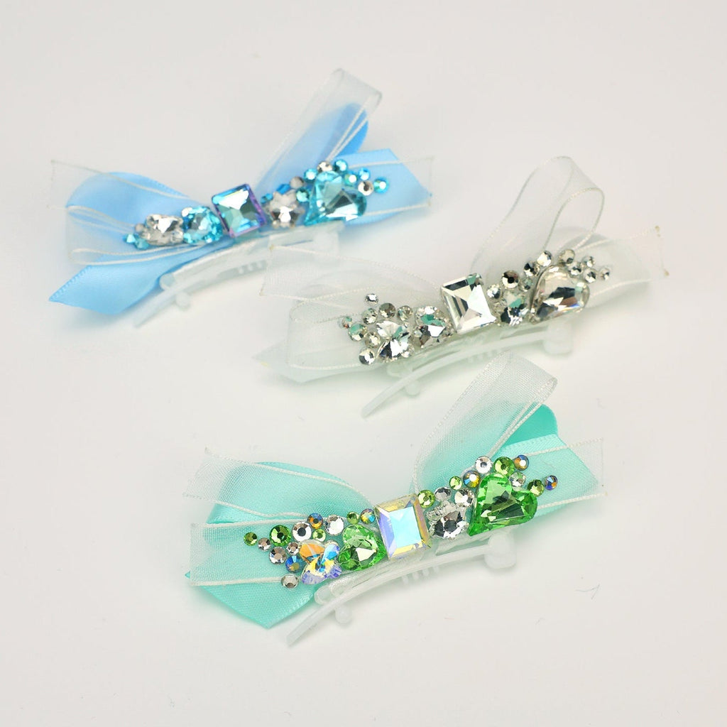 Crystal ribbon hair clips with bow accents, featuring blue and green rhinestone details