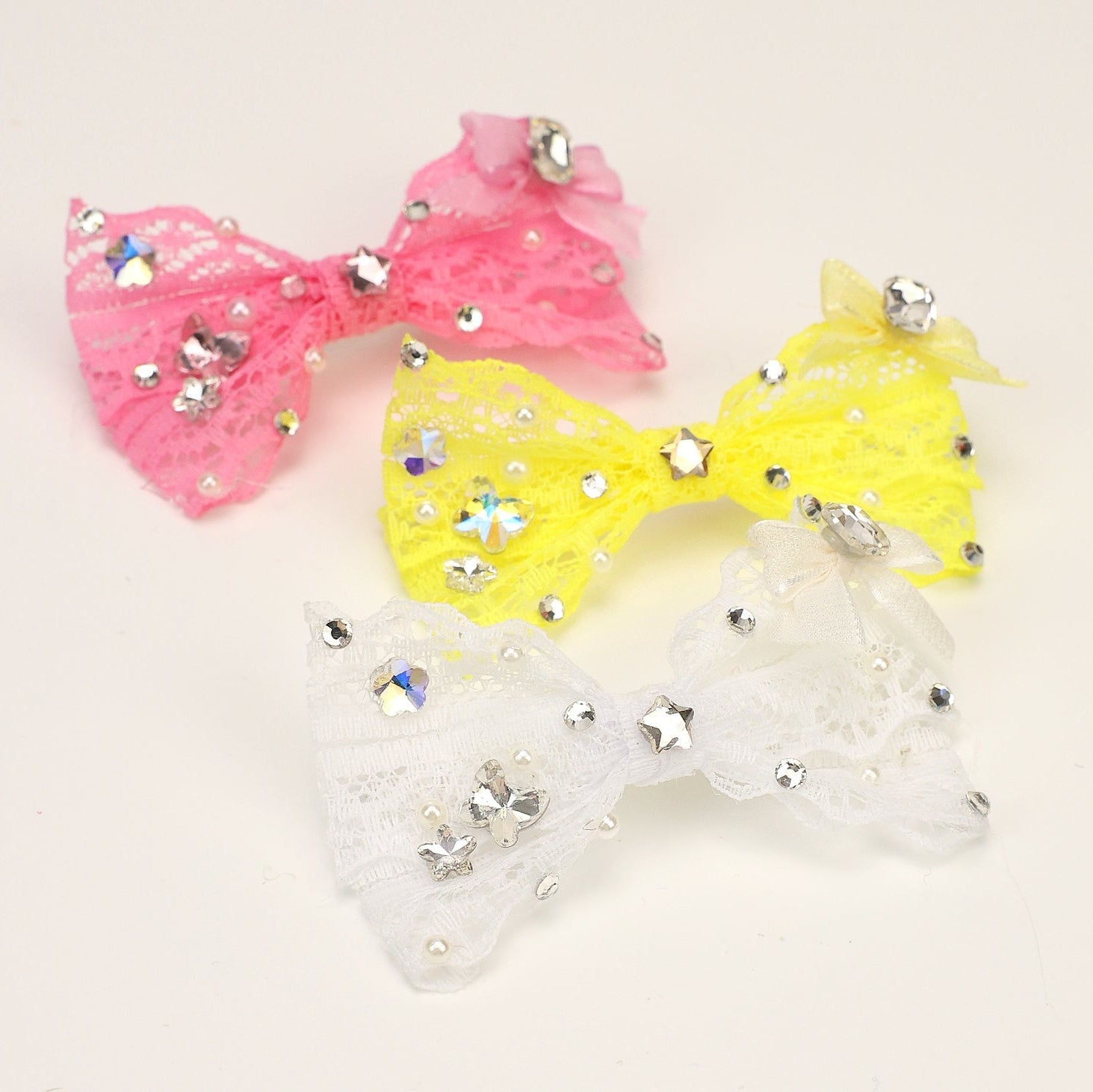 Lace rhinestone bow hair clips: pink, yellow, and white bows