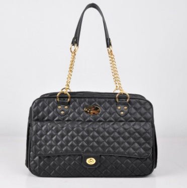 Black quilted pet carrier tote with gold chain straps and front logo patch