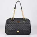 Black quilted pet carrier tote with gold chain straps and front logo patch