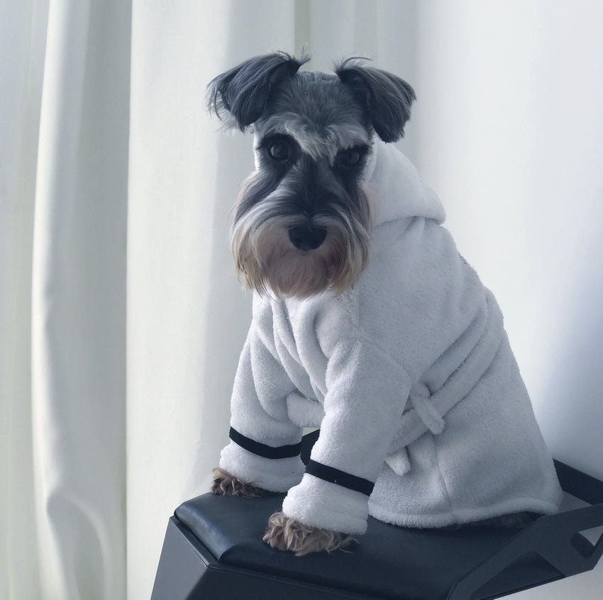White pet bathrobe with hood and dark cuffs, terry fleece, seated dog on box