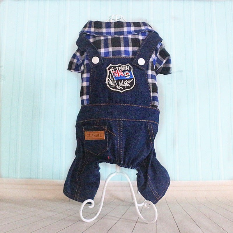 Navy and plaid dog coverall with short sleeves, front emblem patch, and denim-style over panel