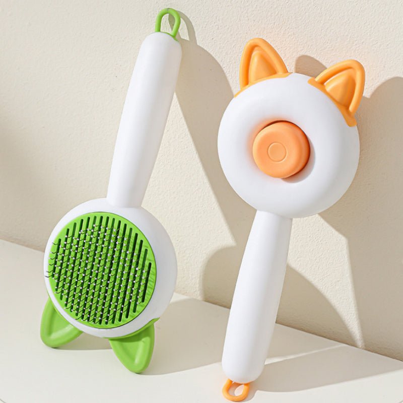 Self-cleaning pet hair grooming brush pair, green and orange bristle pads with white handles