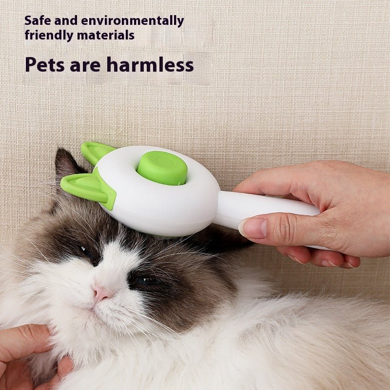 Self-cleaning pet grooming brush with green bristle pad on a cat’s fur
