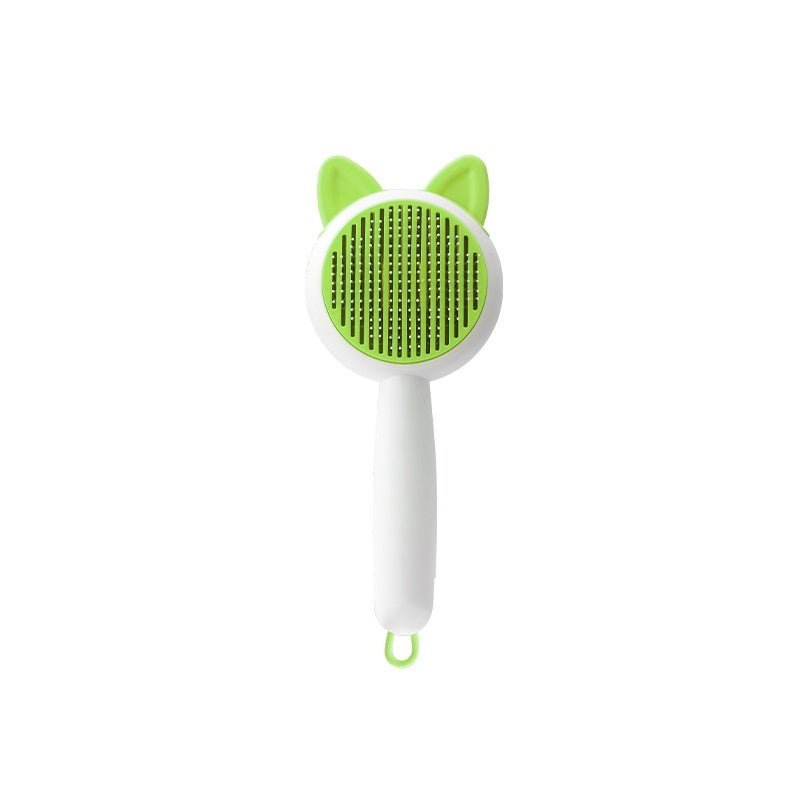 Self-cleaning pet hair grooming brush, green bristle pad with cat ears and white handle