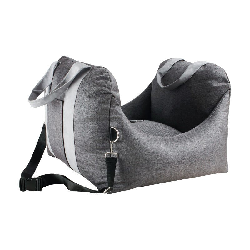 Grey dog car carrier seat with black strap and front fastening buckle