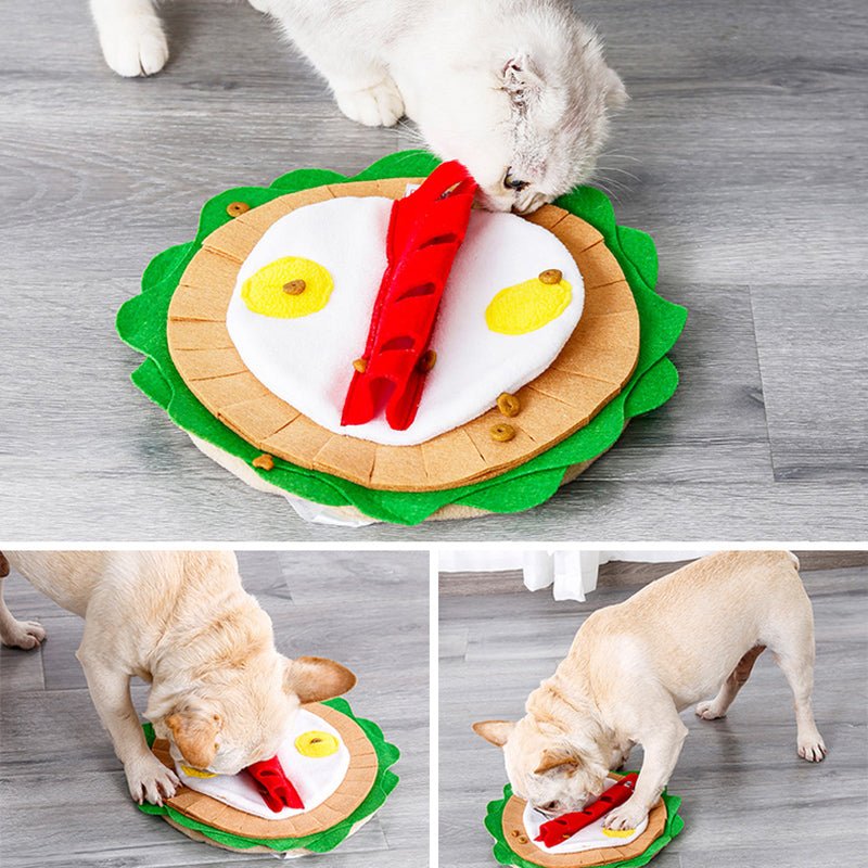 Dogs playing with a round snuffle mat; green edge, white center, yellow egg pieces, red strip