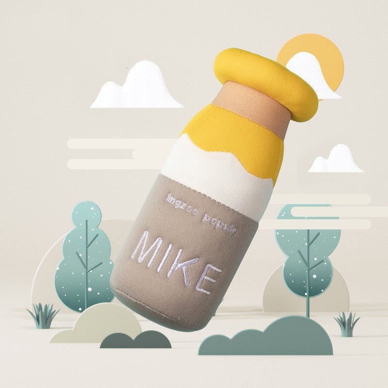 Milk bottle-shaped plush dog toy with yellow cap and beige body